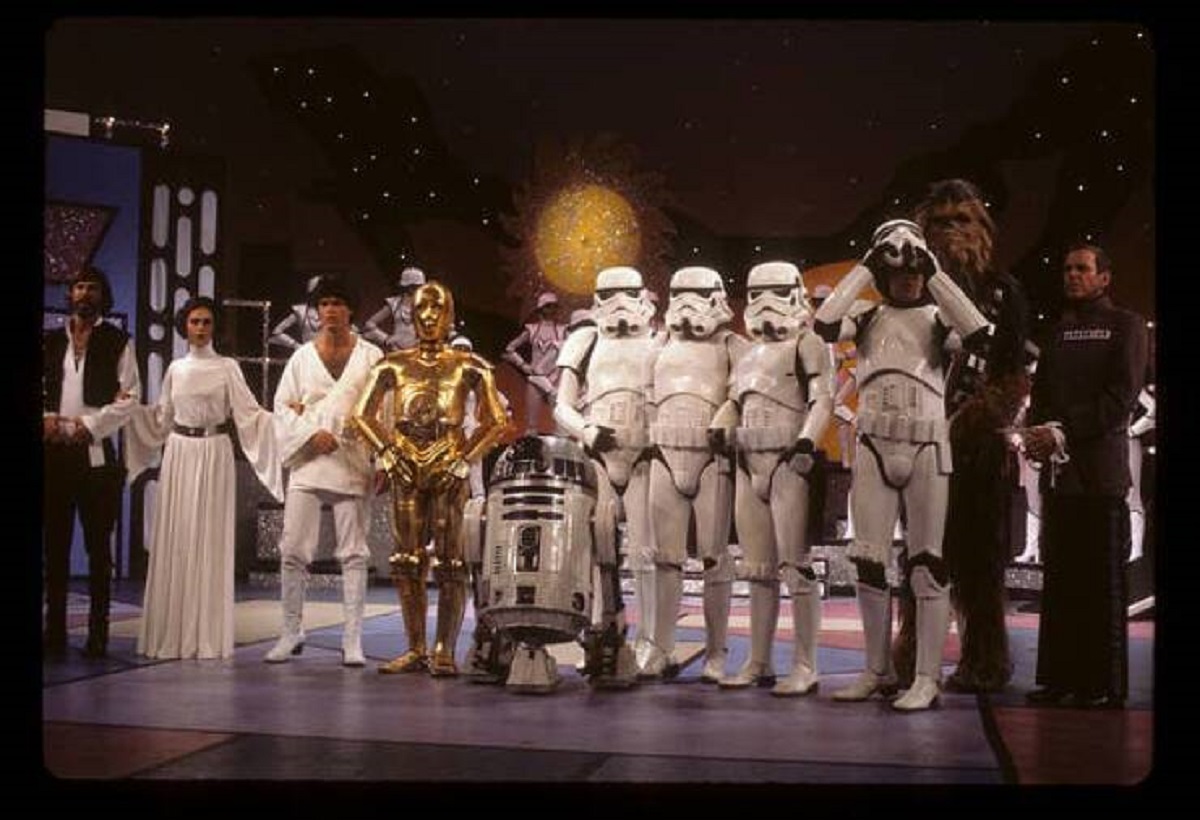 The spoof was made with the approval of George Lucas, who allowed the show to use the original Stormtrooper and Darth Vader costumes. Along with the authentic costumes and props (including the actual R2-D2 used in the movie), Anthony Daniels played C-3PO, and Peter Mayhew played Chewbacca: