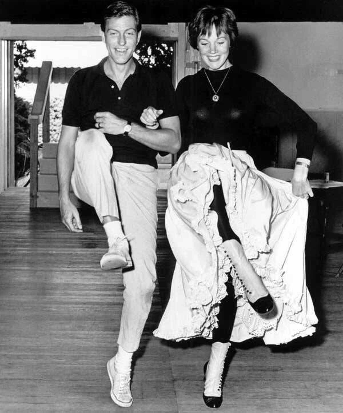 Here's a behind-the-scenes photo of Dick Van Dyke and Julie Andrews rehearsing a dance number for Mary Poppins: