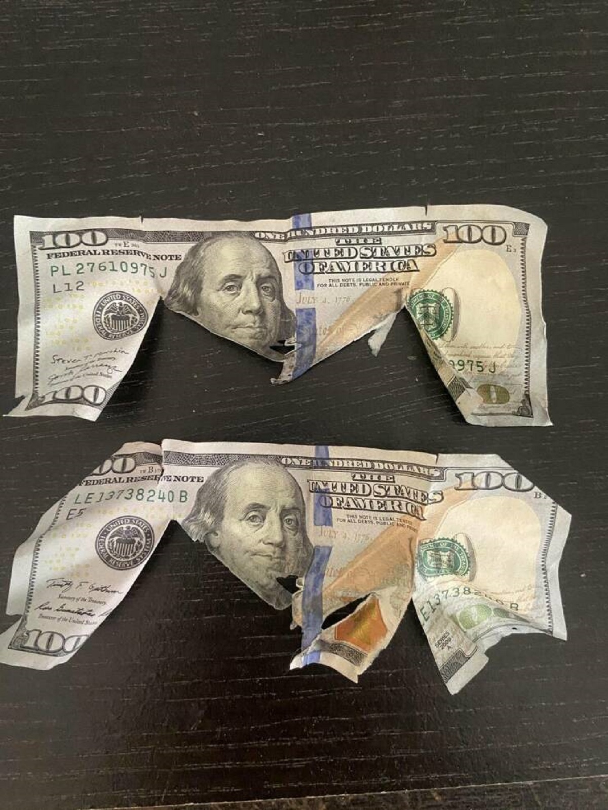 "Found these mangled $100s in the trap of my dryer filter"