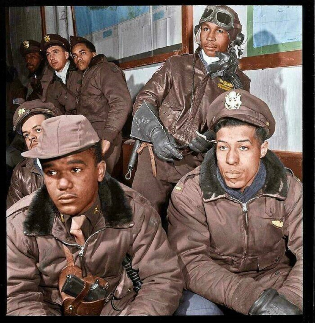 "Tuskegee Airmen Getting Briefed Before A Mission. 1945"