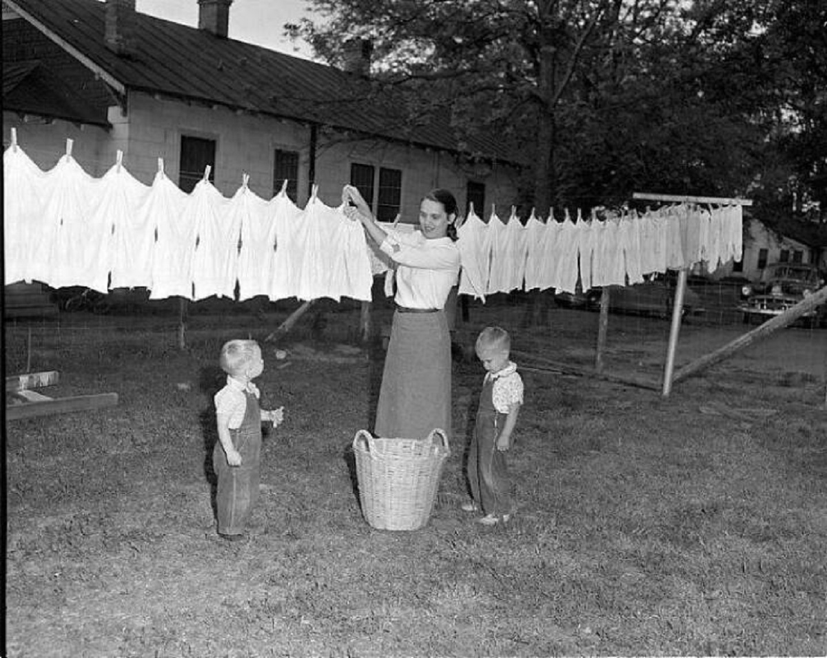 "In This Image From 1955, We See A Woman Hanging Her Laundry On The Clothes-Line In Her Backyard. When I Was Growing Up - In The 1960s And 1970s - Every Backyard On My Street Had A Clothes-Line. While Hanging Out Their Laundry, The Neighbors Would Holler To Each Other"