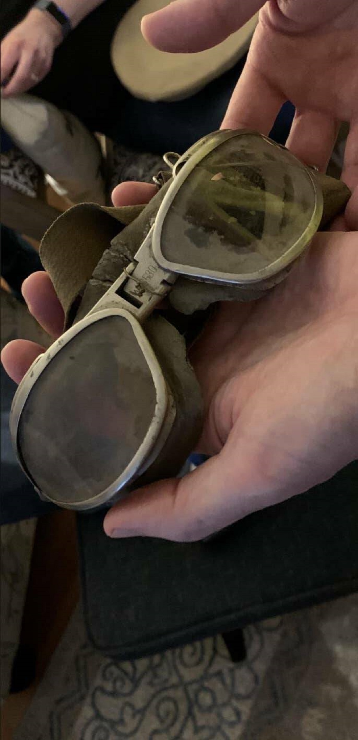 These Air Force goggles from WWII still have dirt on them.