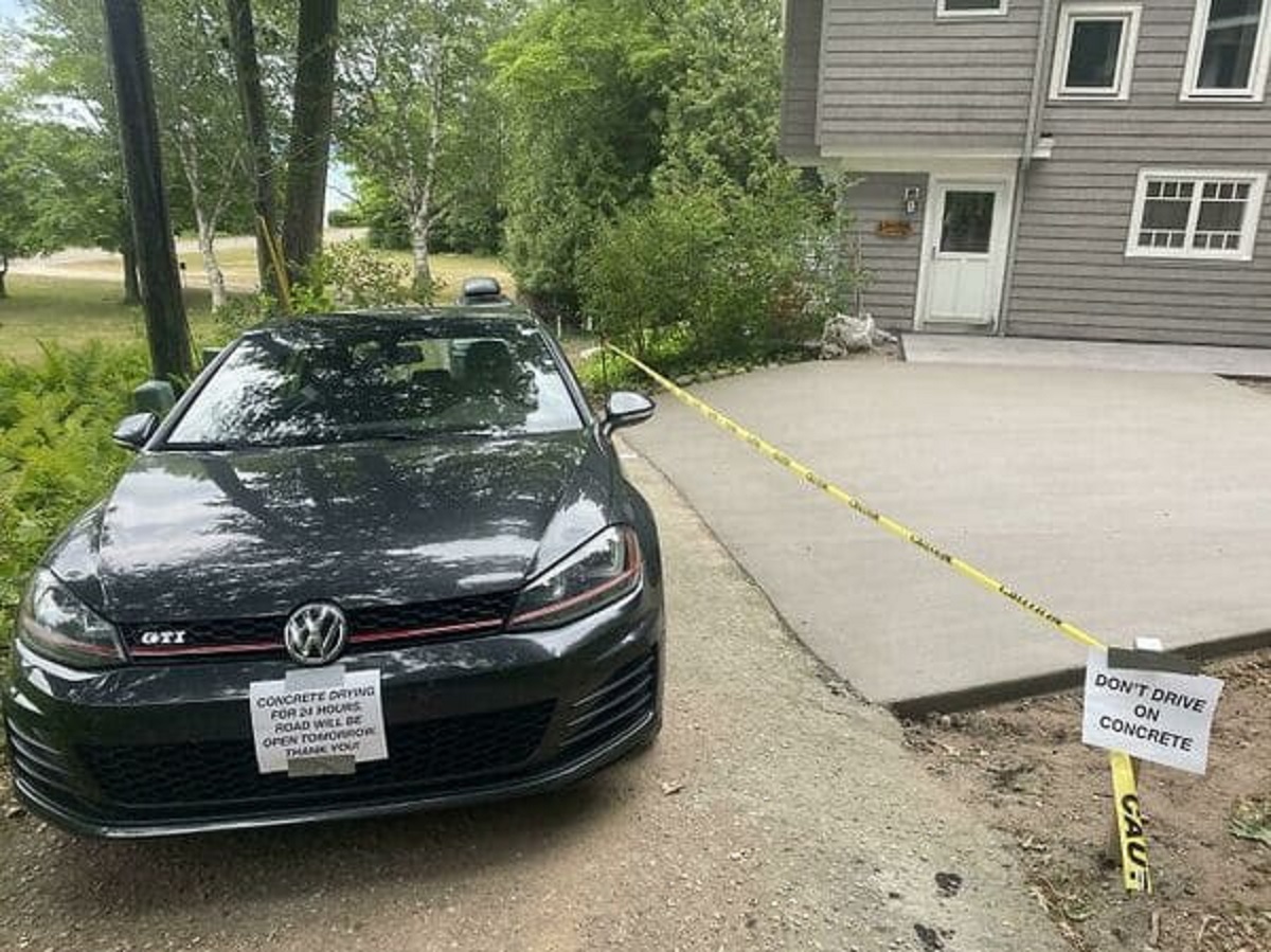 “Our Neighbors Solution To A Newly Poured Driveway On A One-Lane Road”