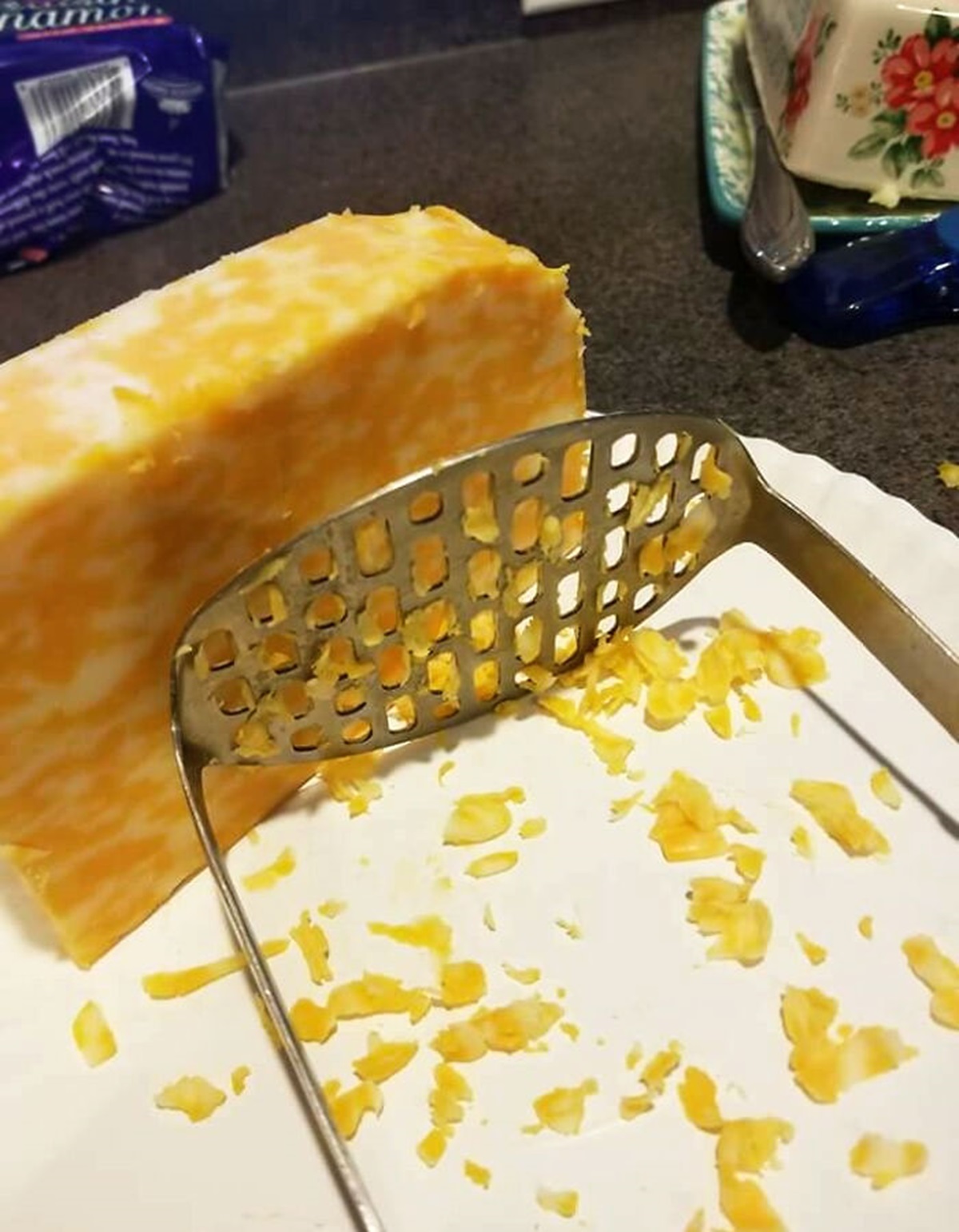 Asked A Friend To Grate Some Cheese. After A Few Minutes, He Asked What He Was Doing Wrong, And It Seems That He Was Trying To Force The Cheese Through The Potato Masher