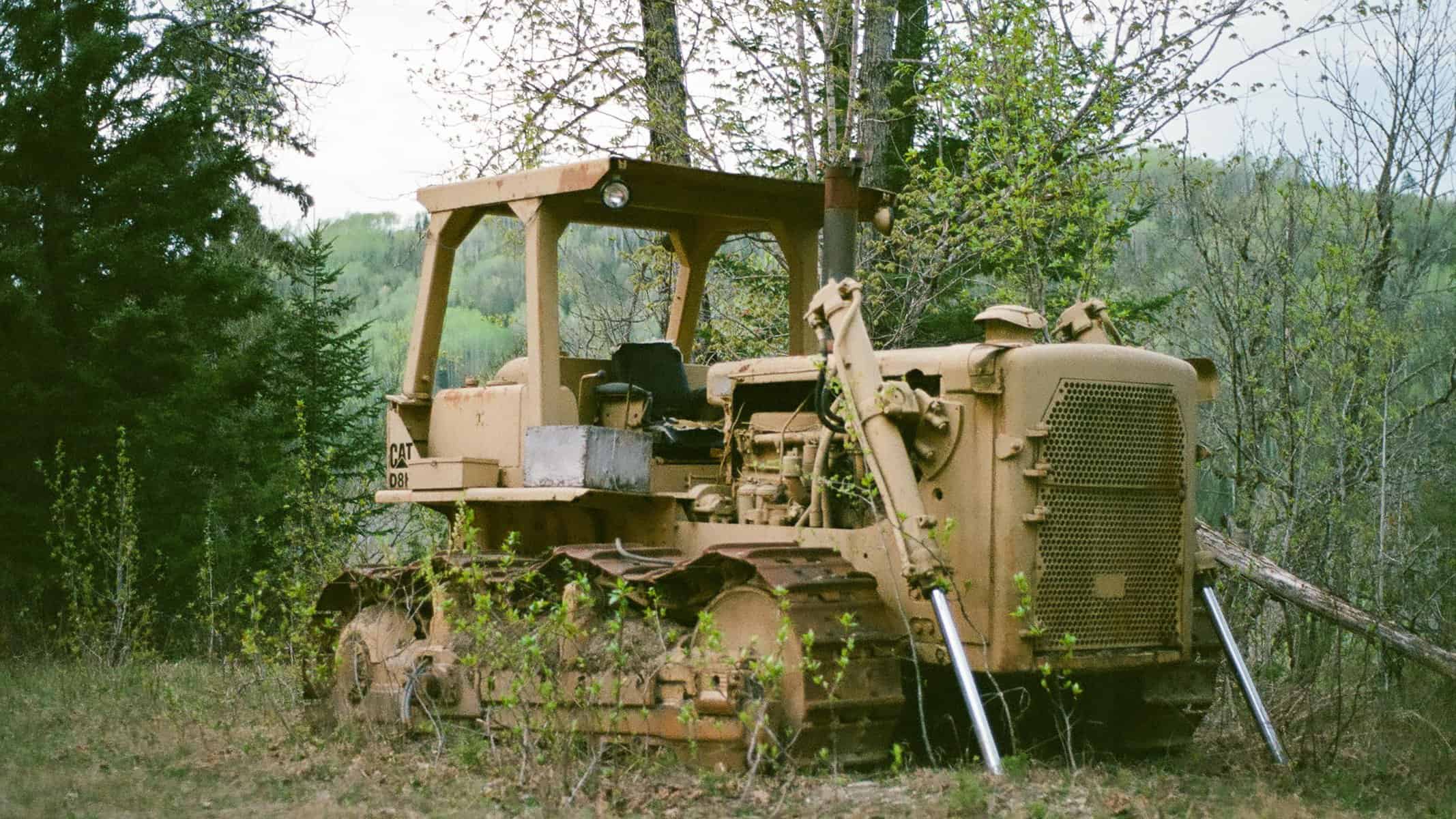 When building remote roads contractors will abandon equipment that is too big and heavy to haul out. This is one of three abandoned dozers on a logging road.