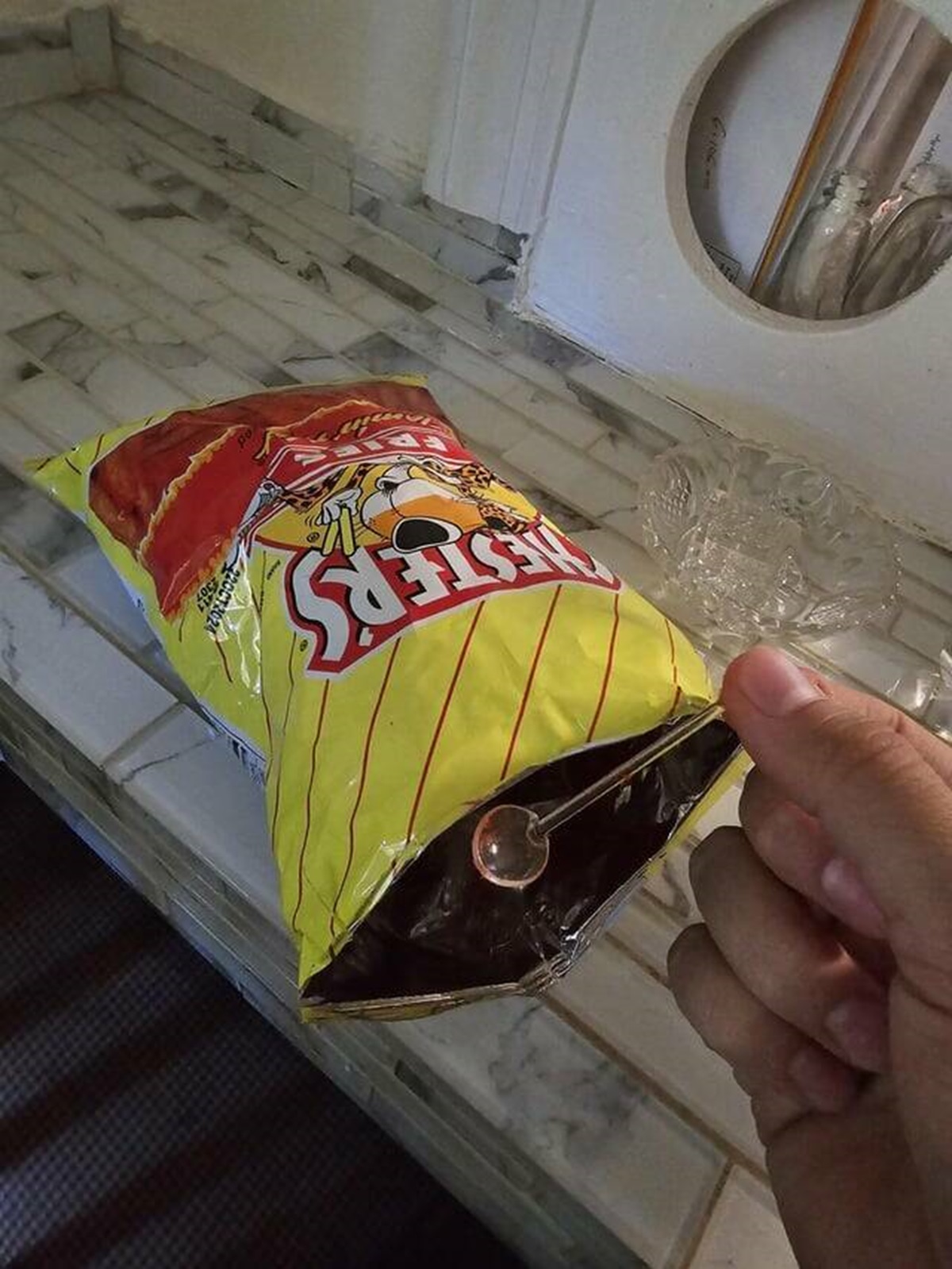 "Found a tiny spoon inside my bag of chips."