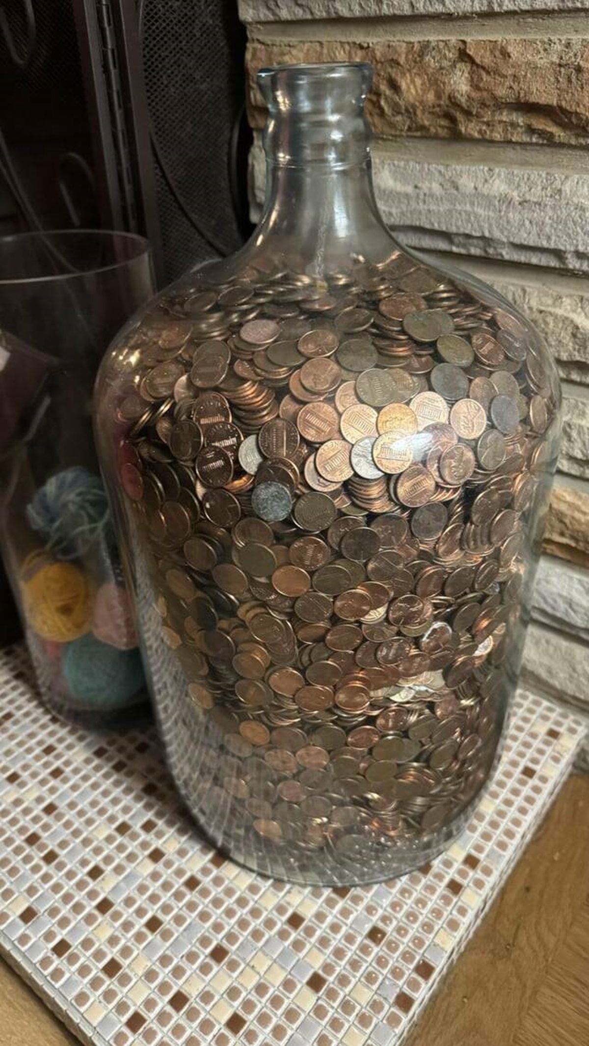 "Old glass water jug full of pennies I found at my grandparents house"