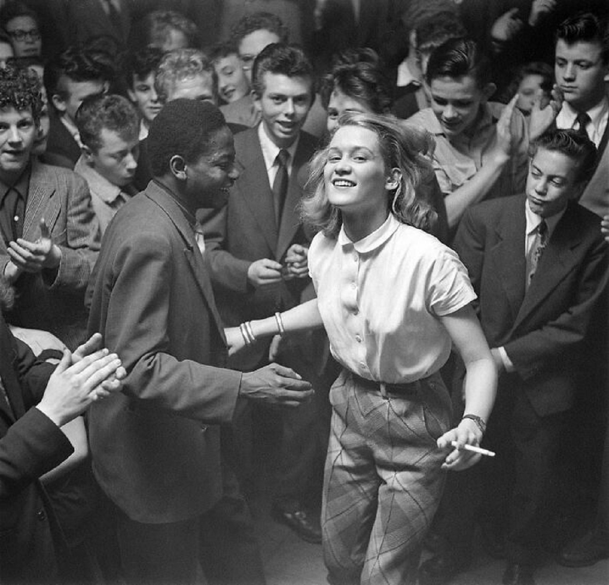 Young people dancing to jazz music at the Storyville Club. Copenhagen, Denmark. 1952. Photo by Helmer Lund Hansen.