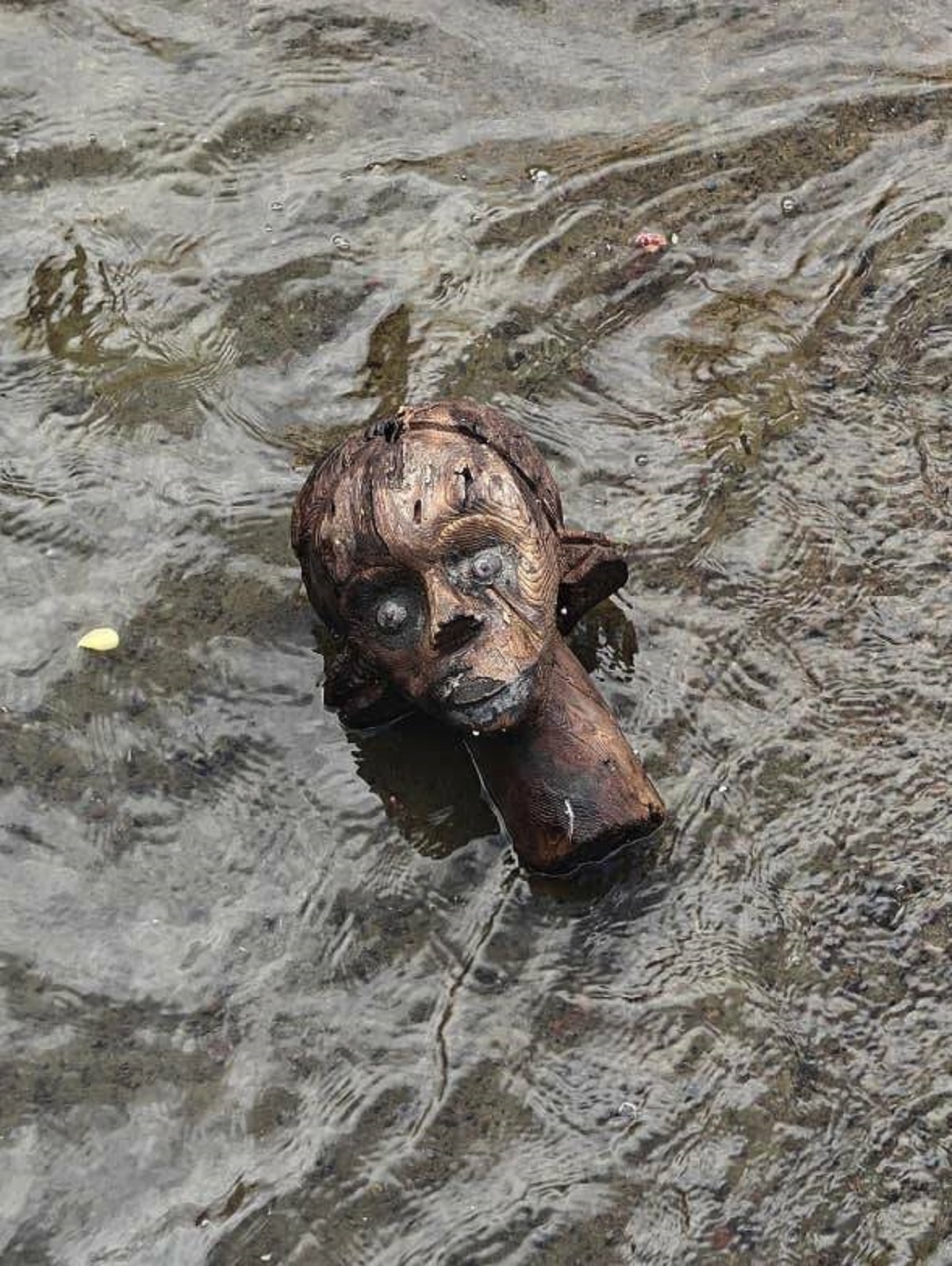 This wooden head someone found washed up in a canal that seems like a bad omen if you ask me: