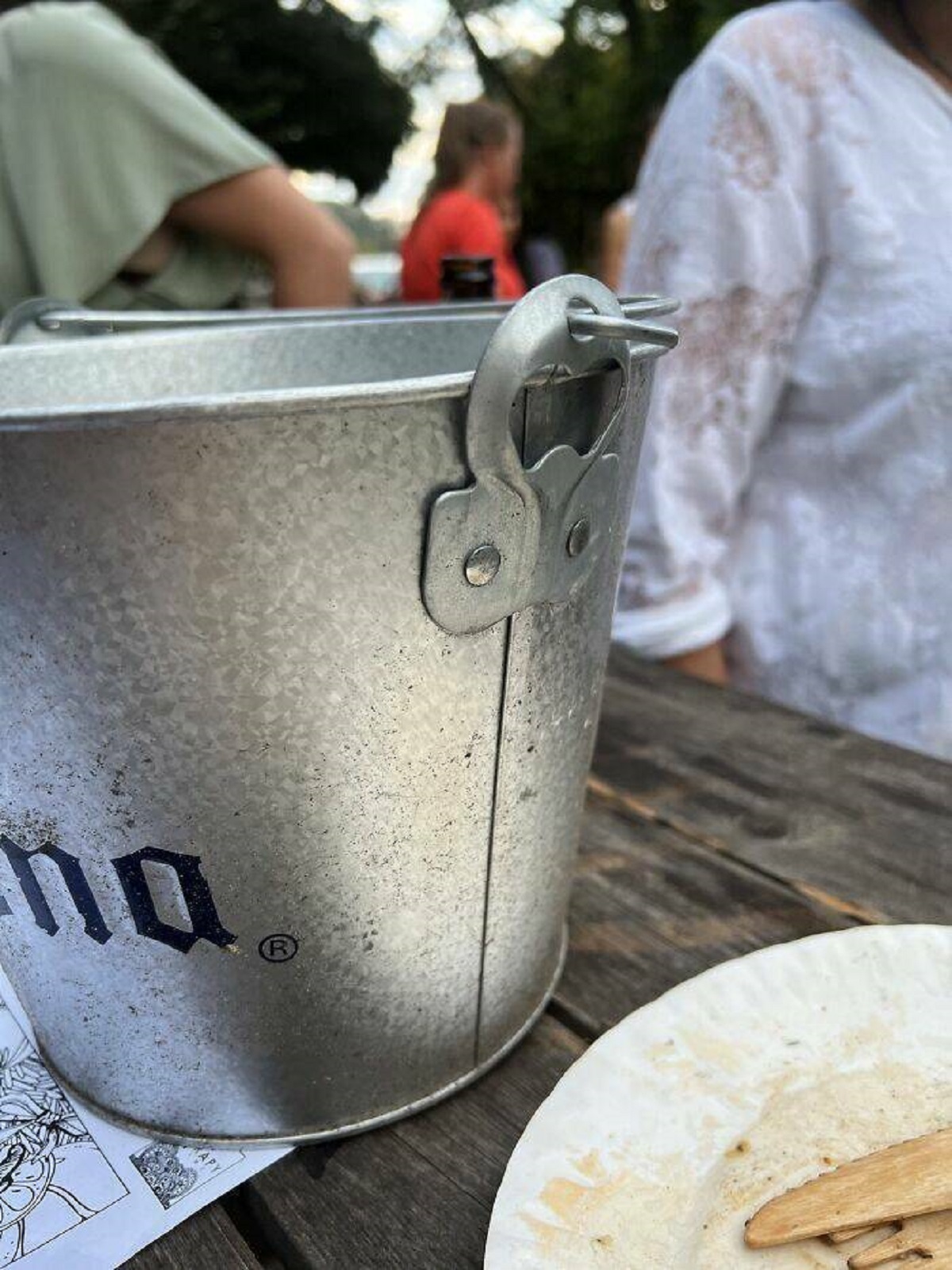 "A Beer Bucket With A Beer Opener On The Side"