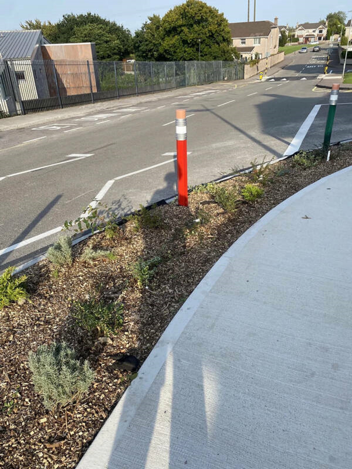 "Bollards shaped like pencils near a primary school."