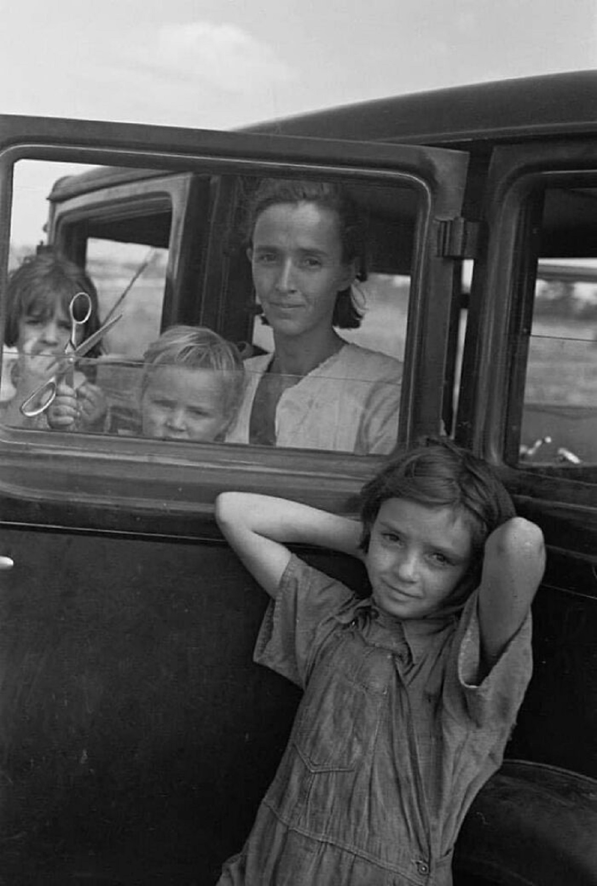 The Family Of A Migratory Fruit Worker From Tennessee Now Camped In A Field Near The Packinghouse At Winter Haven, Florida, 1937