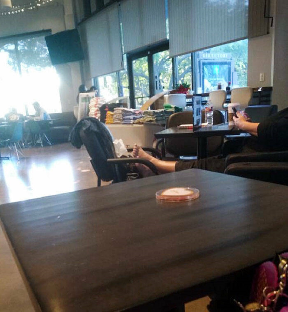 "Some Woman At The Coffee Shop Has Her Bare Feet On A Chair"