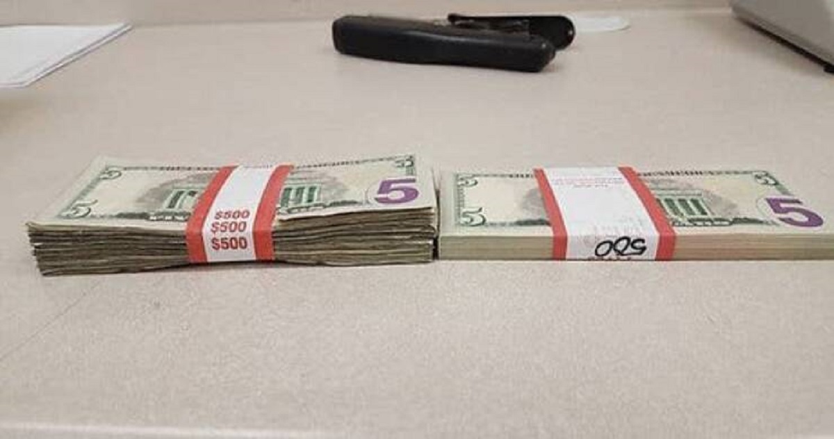 A stack of circulated $5 bills vs. new $5 bills: