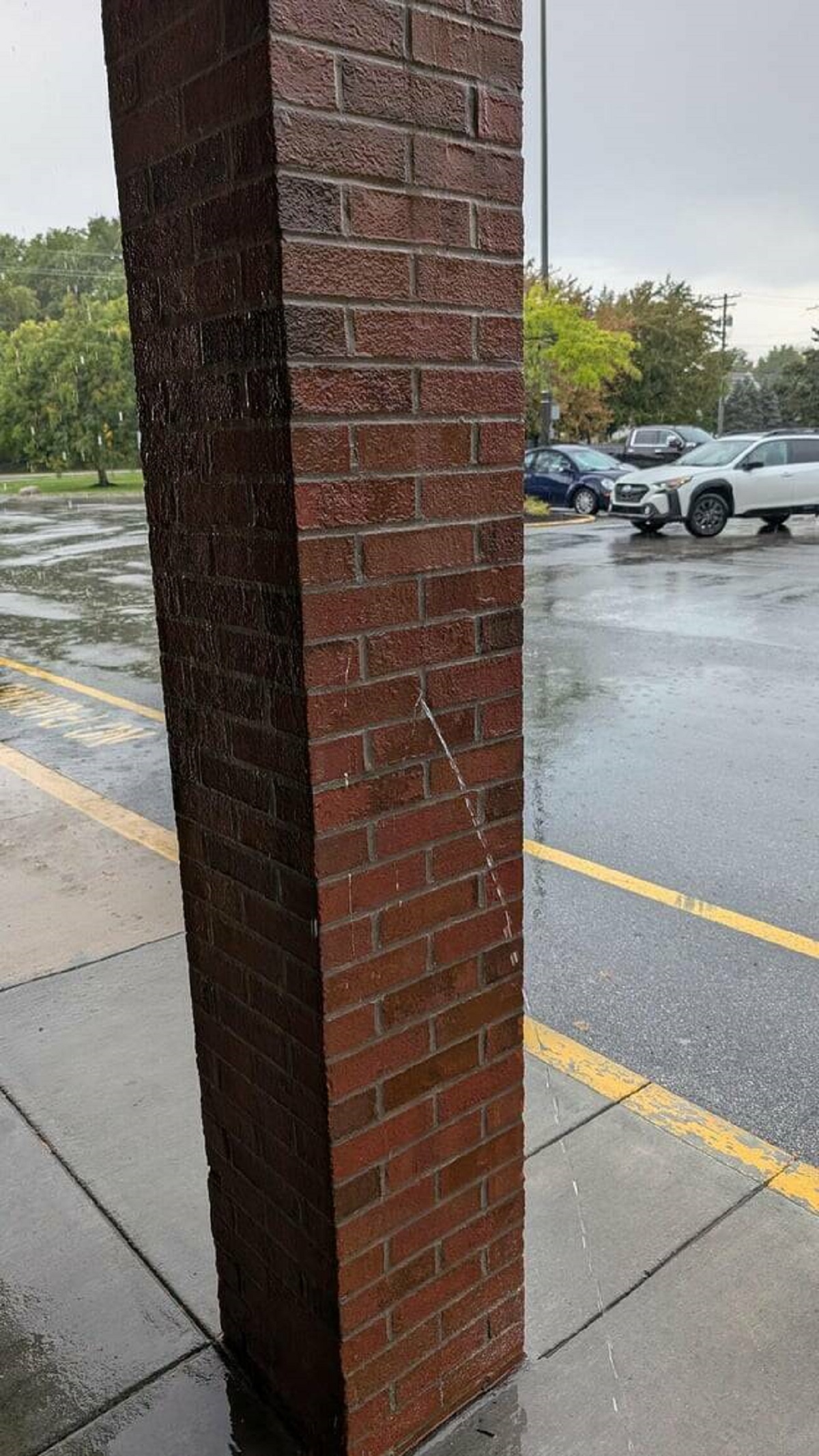 "Water leaking out of this support, at my grocery store"