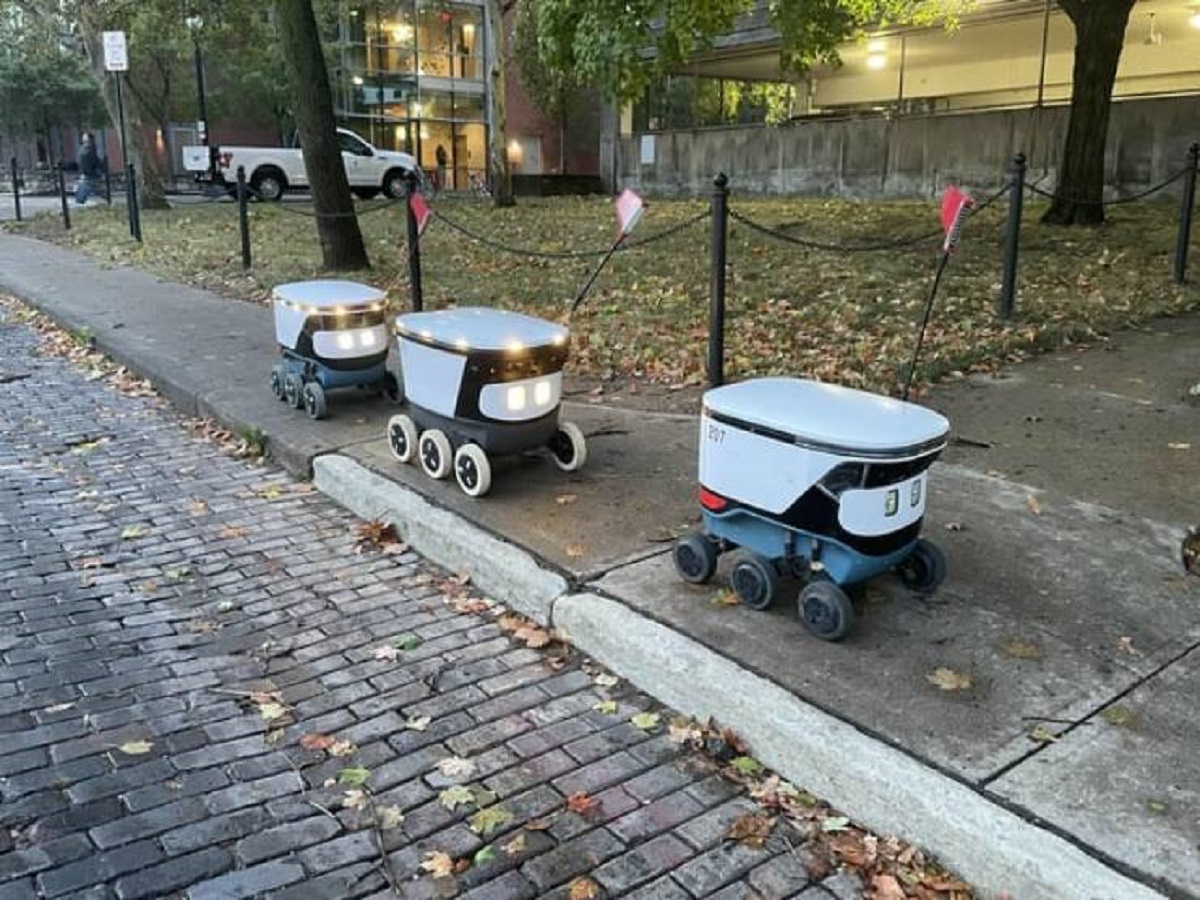 "Food delivery robots stuck behind another one with a dead battery"