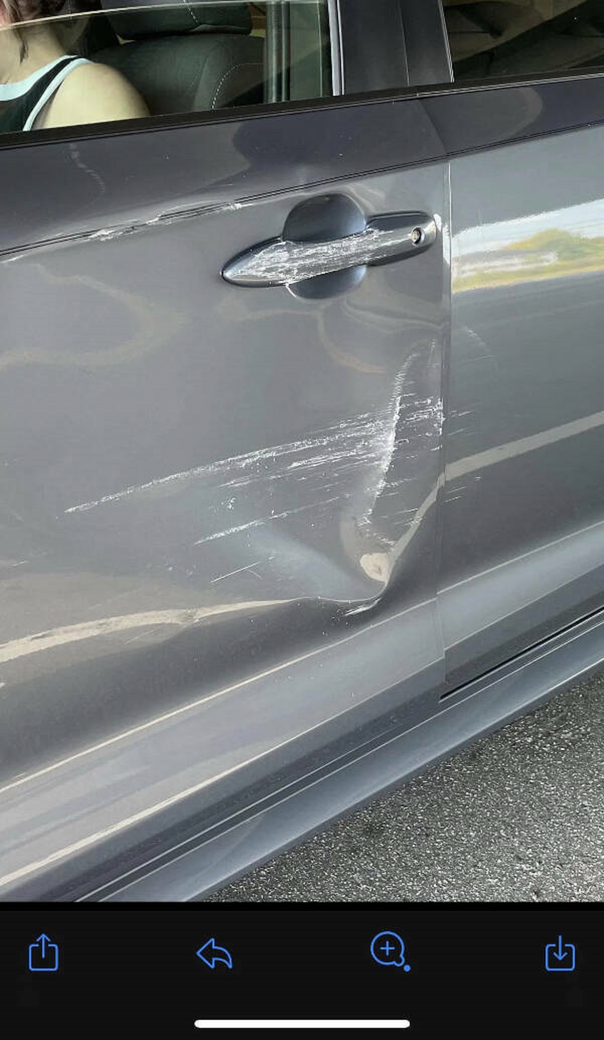 “Literally just bought my first car ever. I was on the way to the dealership to drop something off and was at the light right outside of the dealer. The car front adjacent to me backed straight into the driver side of my car to avoid a semi truck that was trying to make a turn. I beeped at her the whole time, but she thought it was the semi truck beeping instead, so she kept backing up further.”