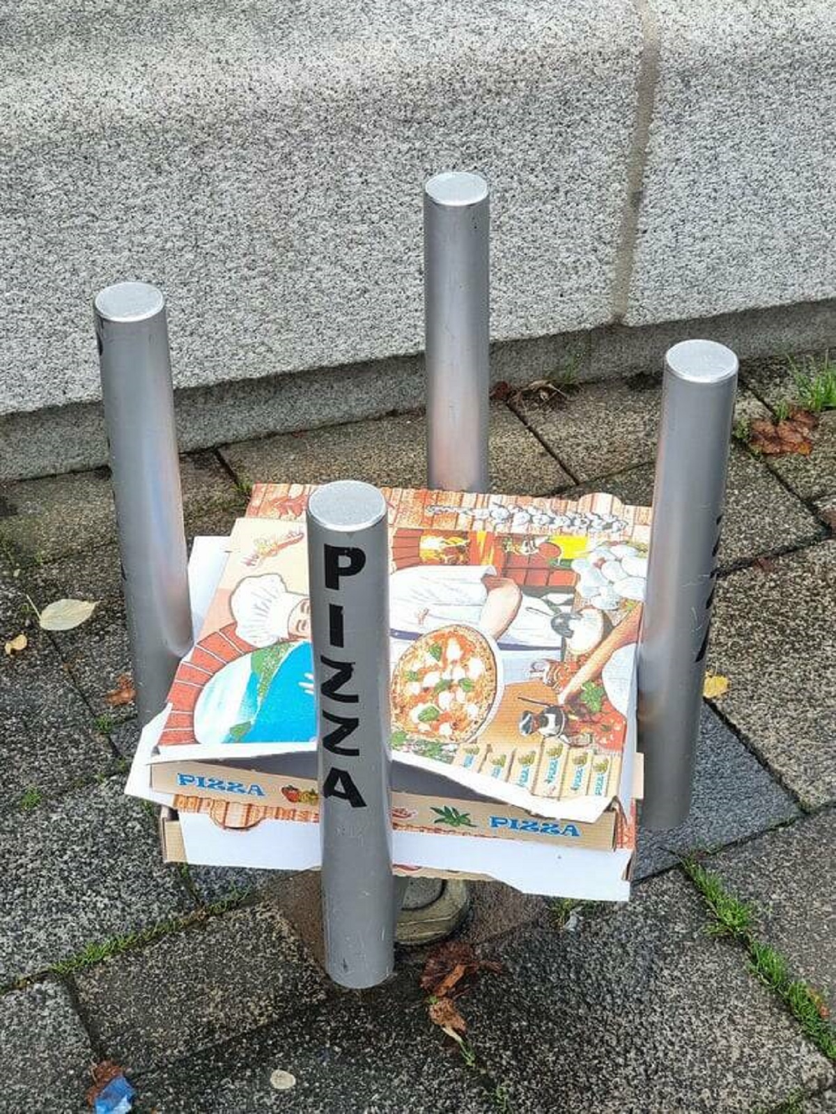 "A pizza garbage bin in Breisach, Germany"