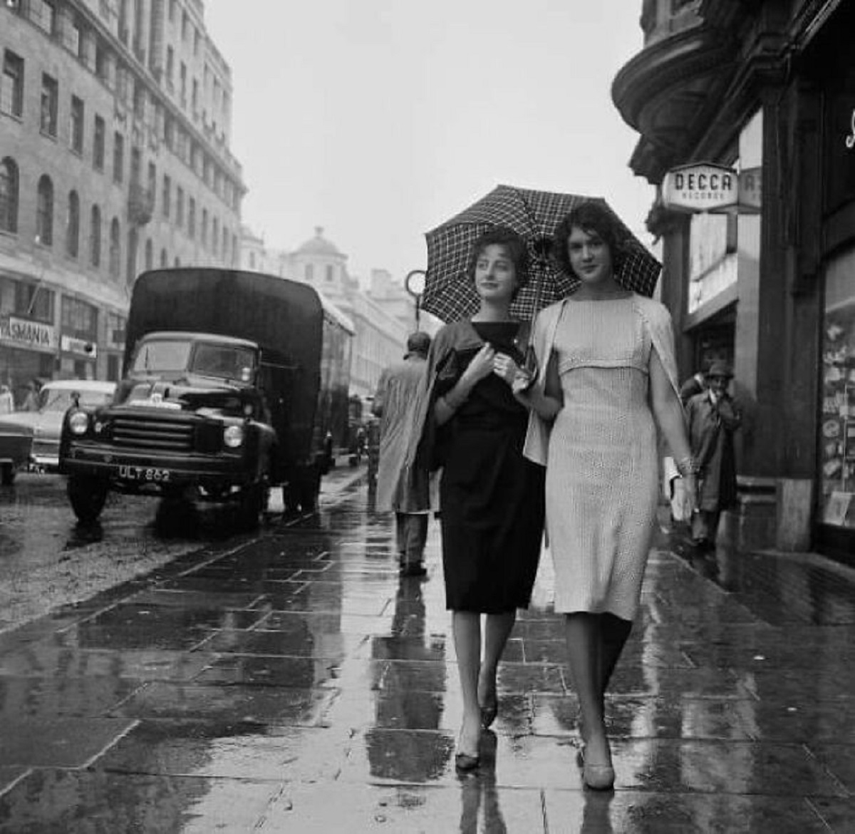 Ladies Sharing An Umbrella, London, 1959