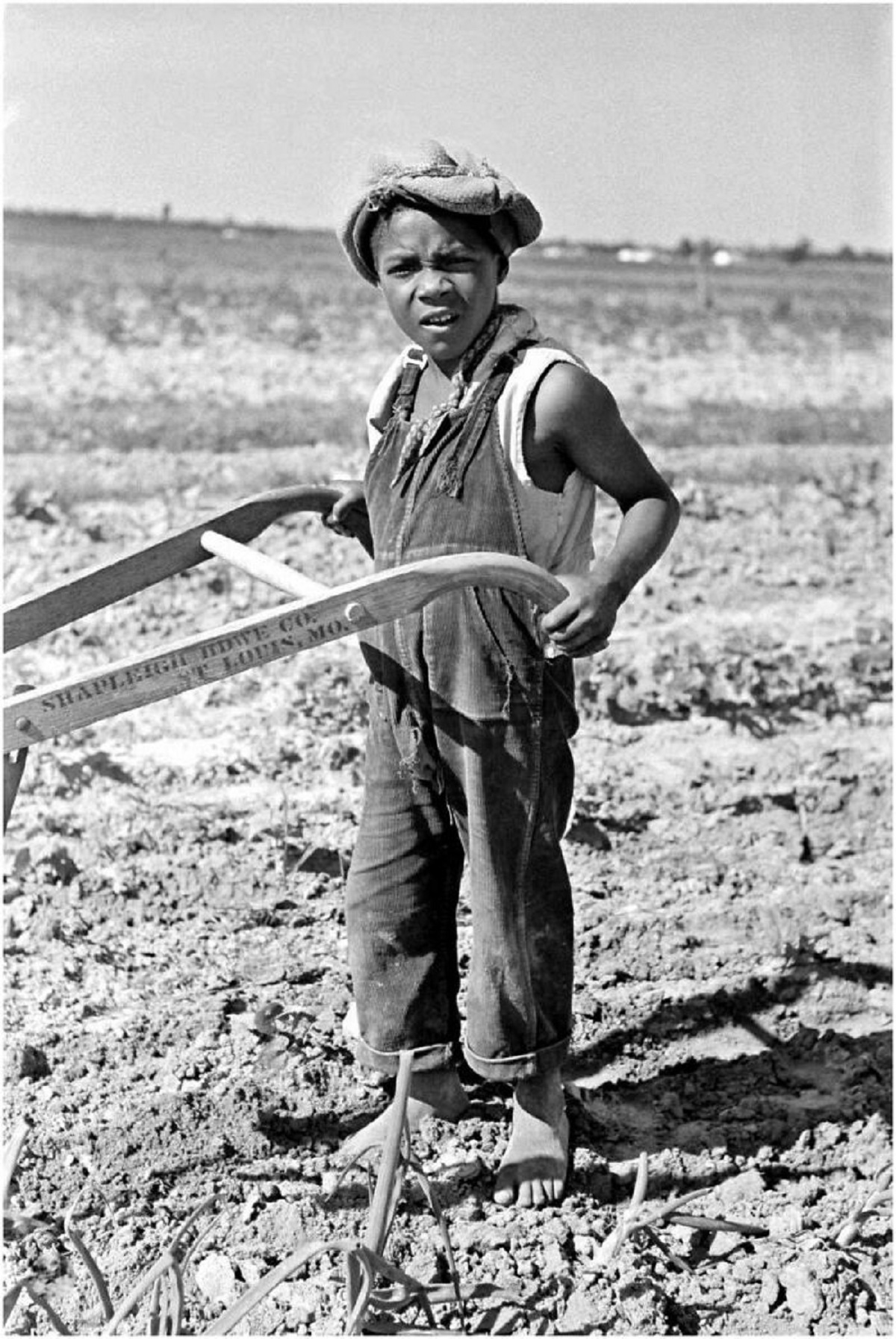 New Madrid County, Missouri. Child Of Sharecropper Cultivating A Field - 1938