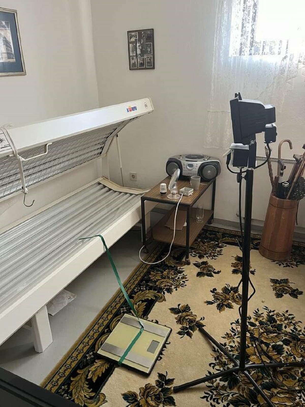 "The Airbnb I’m staying in has a room with a weight scale taped to a tanning bed, in front of a photography light"