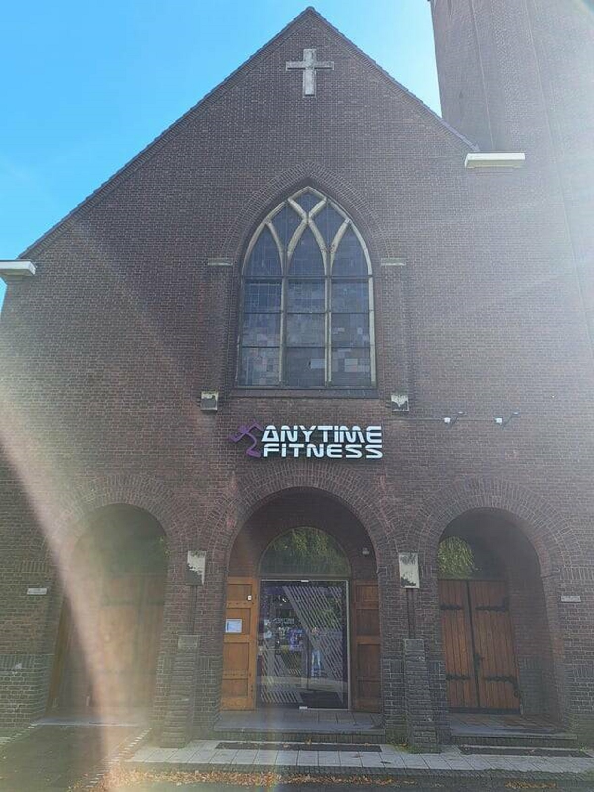 "A church converted into a anytime fitness"