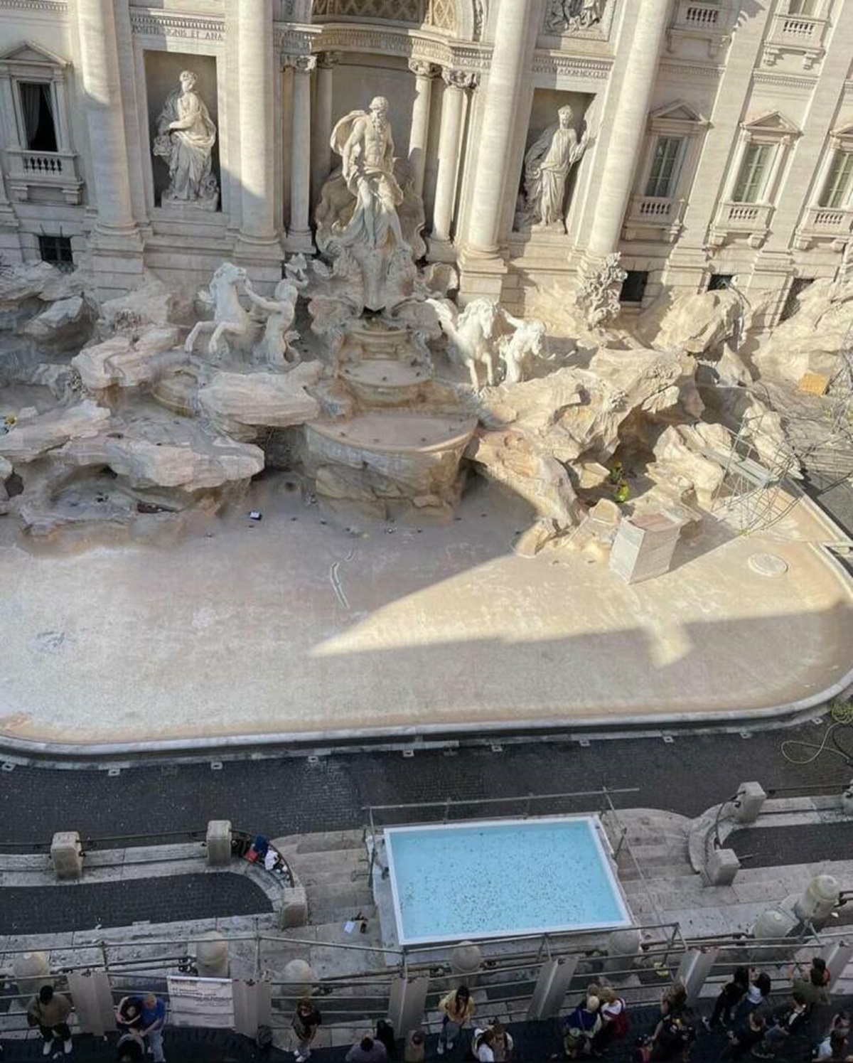 "The Trevi fountain in Rome has been emptied and a little pool was put in front of it so tourists could throw a coin."