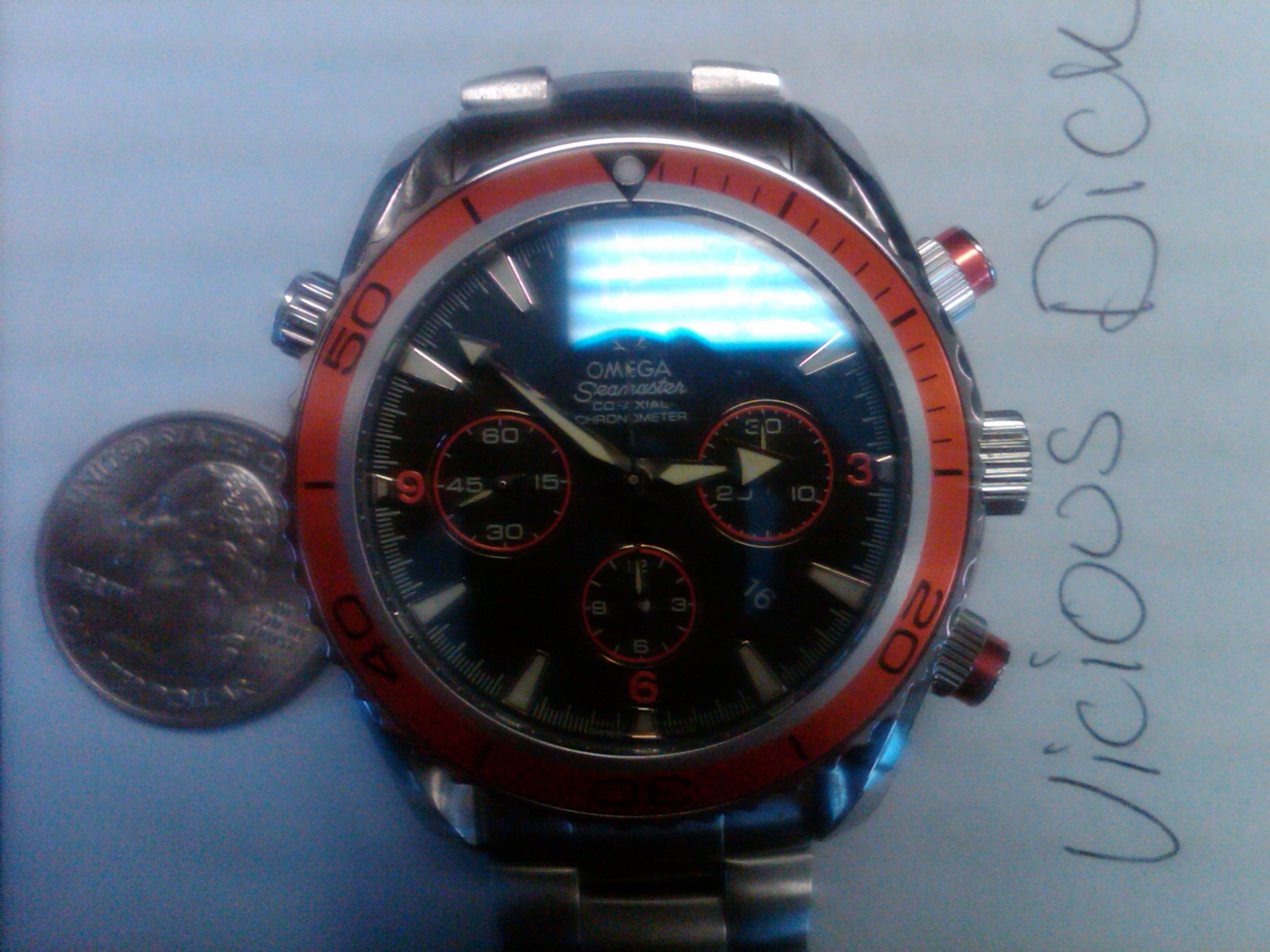 I just got this a few months ago and am considering selling it.  Its a 2009 Omega Seamaster Planet Ocean Orange Special Cronograph.  Waterproof to 600m/1200 ft.  Automatic movement smooth sweeping hand.  blah blah.  Number 114023 of 120000.   