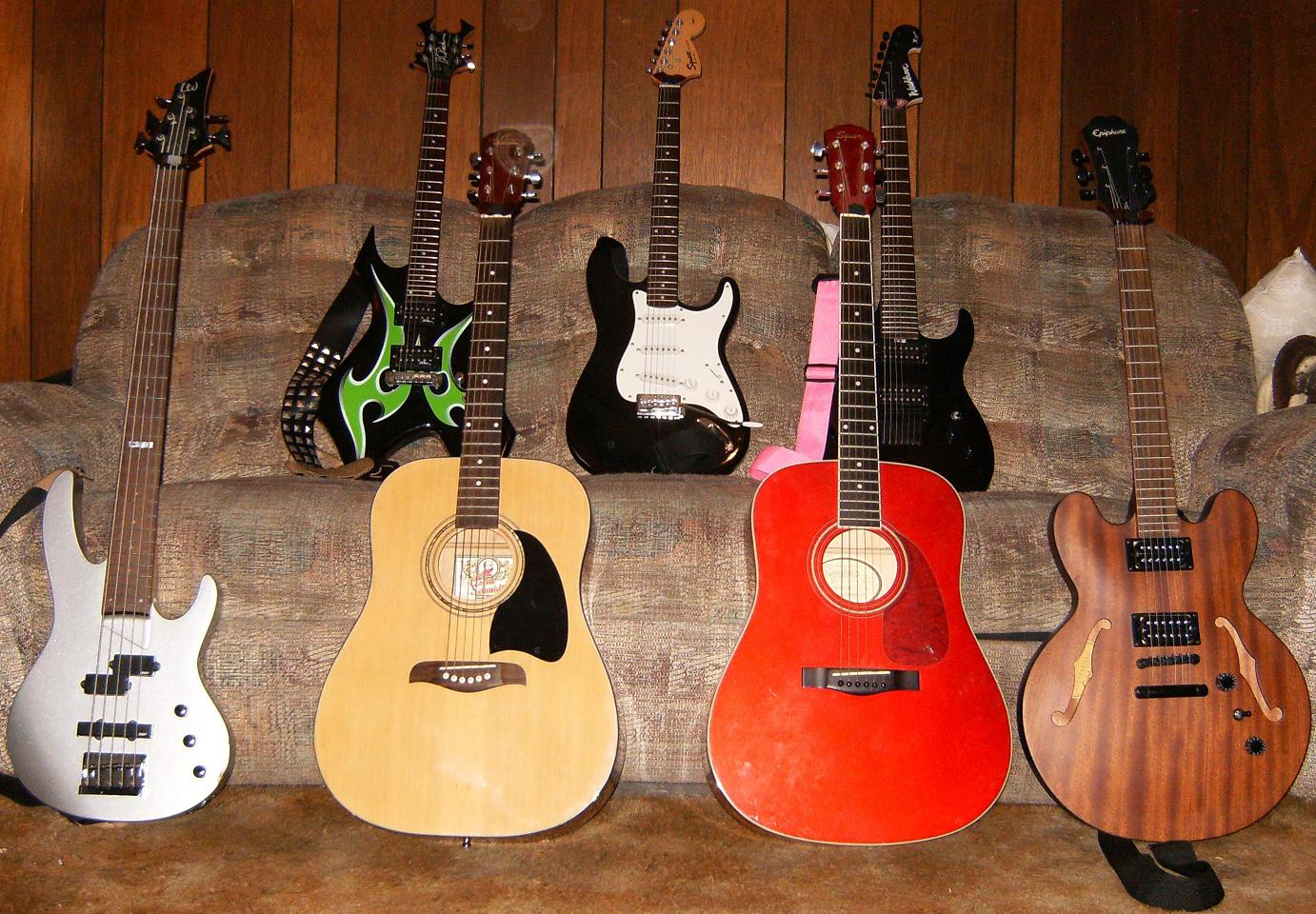 My three solid body electric guitars, My one semi-hollow body guitar, my two acoustic guitars and my bass. Anyone like?
