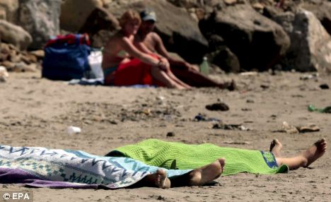Two gypsy girls, age 11 and 10, are left dead on a beach two days after they drowned and washed ashore in Italy. The beachgoers just covered them up and went about business as usual.