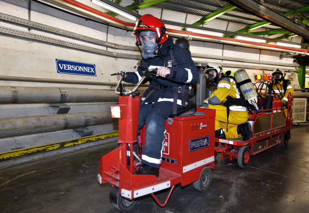 French, Swiss and CERN firemen move rescue equipment through the LHC tunnel.