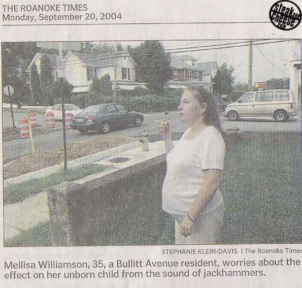 Woman is worried about her baby hearing the jack hammers.