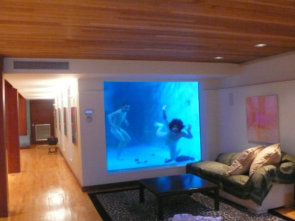 FUCK YEAH!!!!!!! SWIMMING IN A GIANT FISHTANK IS THE NEW WAY TO PARTY.