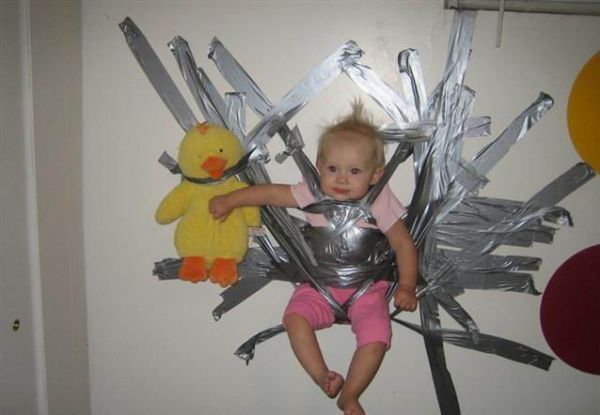 Got ducktape? Apparently it's the parent's solution to keeping the tot "safe"--that's just wrong! Strangely the kid doesn't look unhappy! 