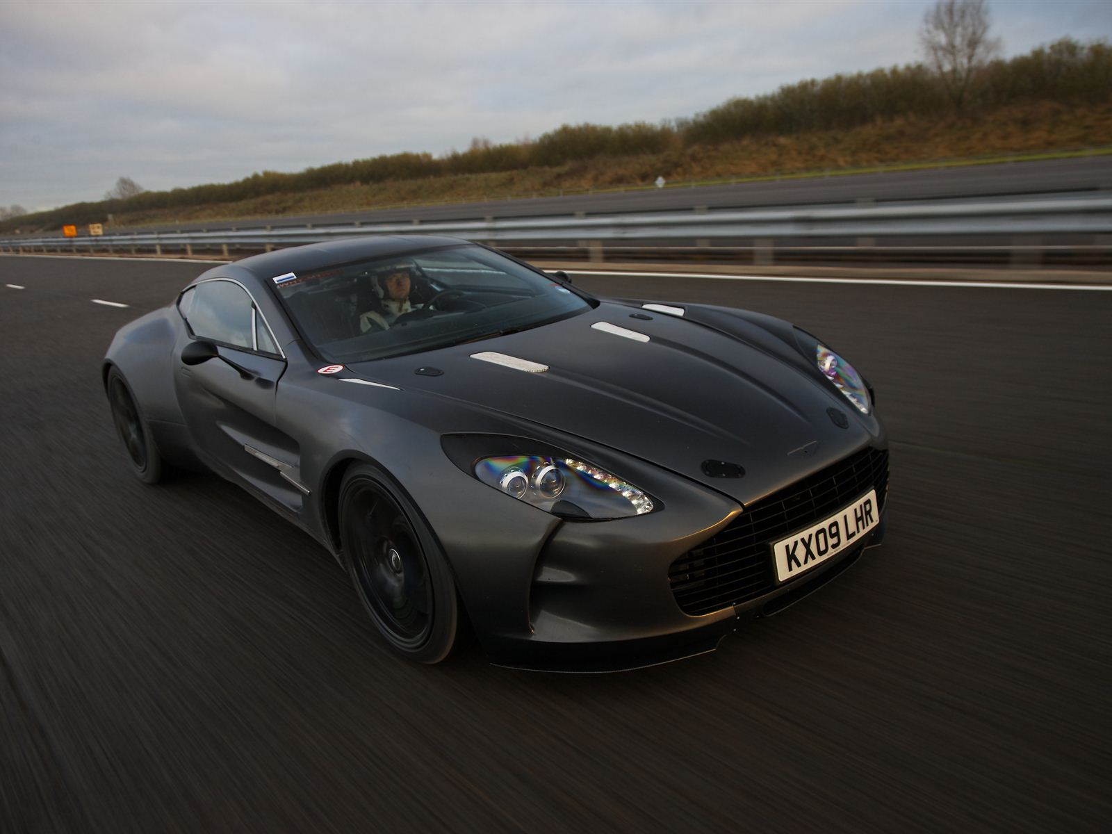The Aston Martin One-77 is a 2 door coupe with a starting MSRP of 1,700,000Top Speed 220 MPH, 0-60 3.5 in Seconds