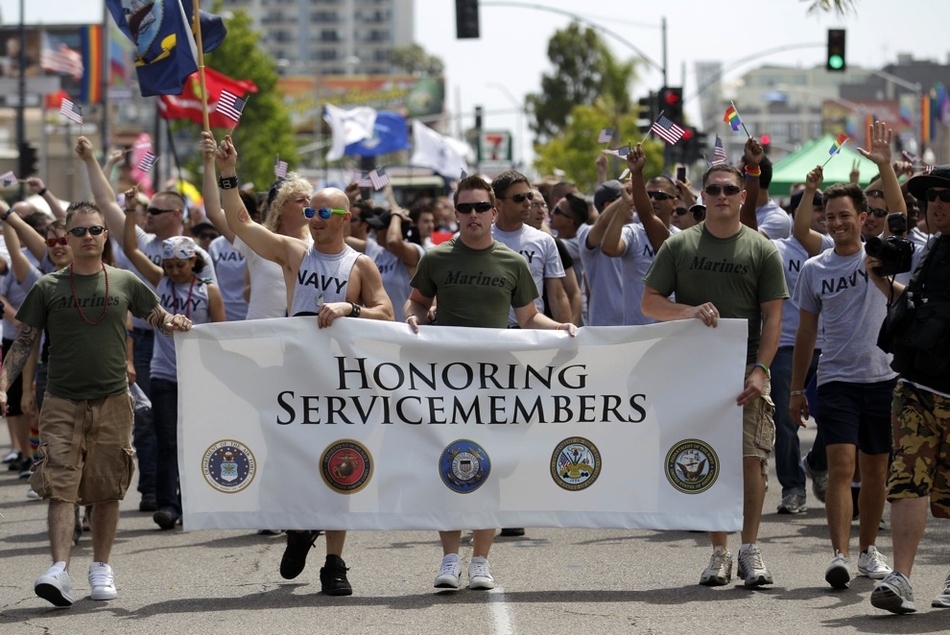 US gay service members march in a gay pride parade for the first time ever.