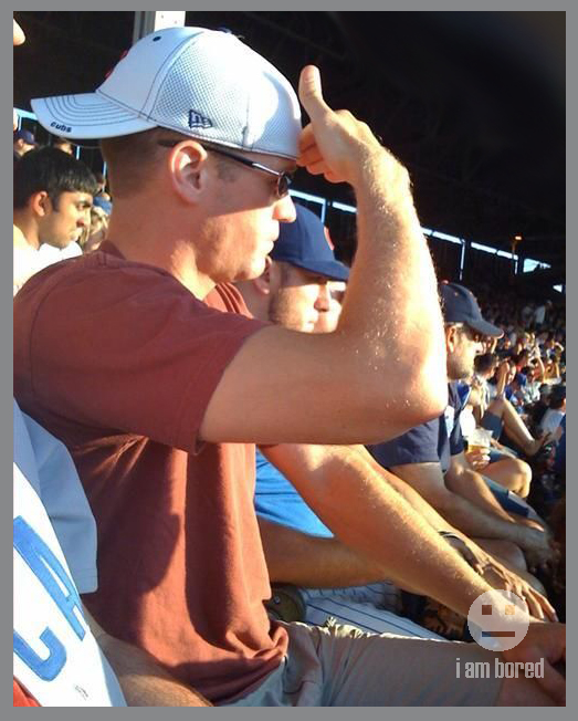 Somebody tell this moron how to work a baseball hat.