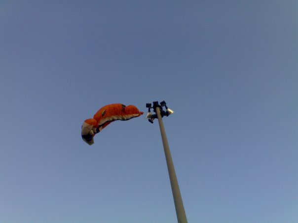 Insane Guy Climbs a Light Post To Free Kite