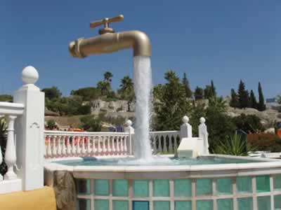 The "Magic tap" (found in "Aqualand" of Cadiz, Spain), which appears to float in the sky with an endless supply of water. Actually, there is a pipe hidden in the stream of water that holds the whole structure.