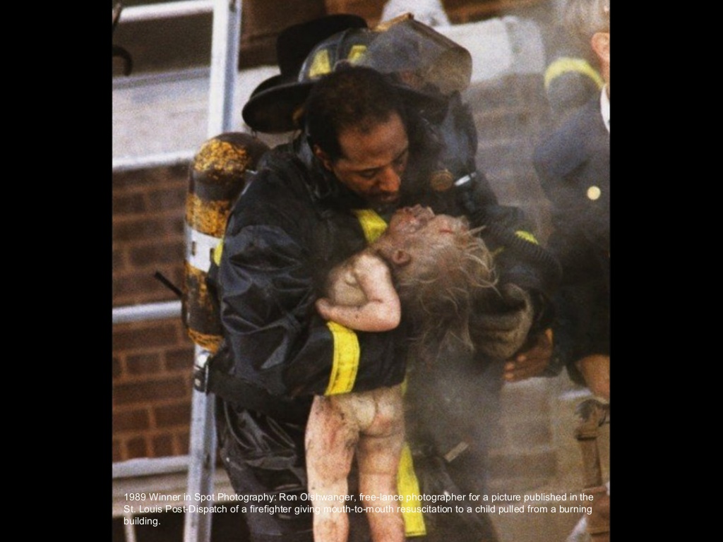 1989:  Ron Olshwanger – “Rescue Attempt.”  Olshwanger captured an image of St Louis firefighter Adam Long giving mouth-to-mouth resuscitation to the limp form of 2 year old Patricia Pettus as he rushed her from a burning apartment on Dec 30, 1988.
The next day, as she clung to life at St. Louis Children's Hospital, the photo ran on the front page of the Post-Dispatch. Before long, it was published in newspapers worldwide, and chronicled a moment that would change fire safety standards around the world.
Six days after the fire, Patricia died. The following spring, Olshwanger was presented the prestigious Pulitzer Prize for spot news photography.
As for Long, the incident branded him a hero — he received a Medal of Honor — though he didn't feel very heroic. "For about a year, I second-guessed myself: 'Did I really do all that I could have done?'" Long said.
The two men grieved when she died. They attended her funeral together.
And as difficult as it was to accept her loss, each found meaning in her death.
"The little girl did not die in vain," said Olshwanger, who said he still receives requests for copies of the photo. "To me, she is a hero because people are going out and buying smoke detectors because of what they see in that photo."
The fire also sparked a friendship between Olshwanger and Long that has remained strong for over 20 years.