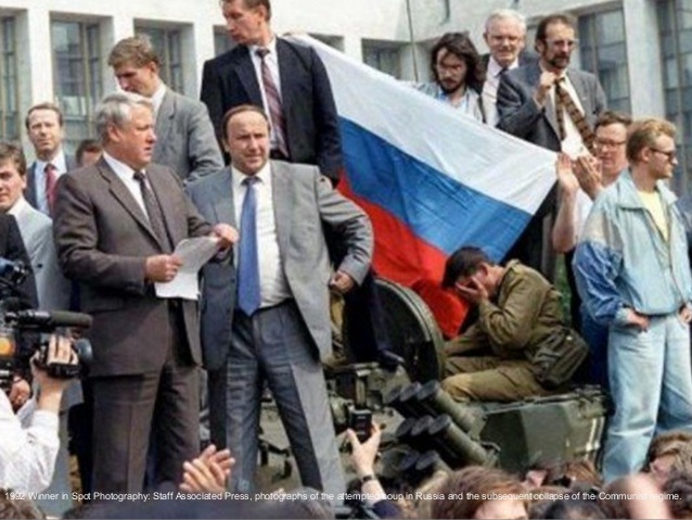 1992:  Olga Shalygin, Liu Heung Shing, Czarek Sokolowski, Boris Yurchenko and Alexander Zemlianichenko – “The Collapse of the Soviet Union.”  
For a series of pictures on the attempted coup in the Soviet Union and the collapse of the Communist regime. 
In the above picture: Boris Yeltsin, president of the Russian Federation, makes a speech from atop a tank in front of the Russian parliament building in Moscow, U.S.S.R., Monday, Aug. 19, 1991. Yeltsin called on the Russian people to resist the communist hard liners in the Soviet coup.