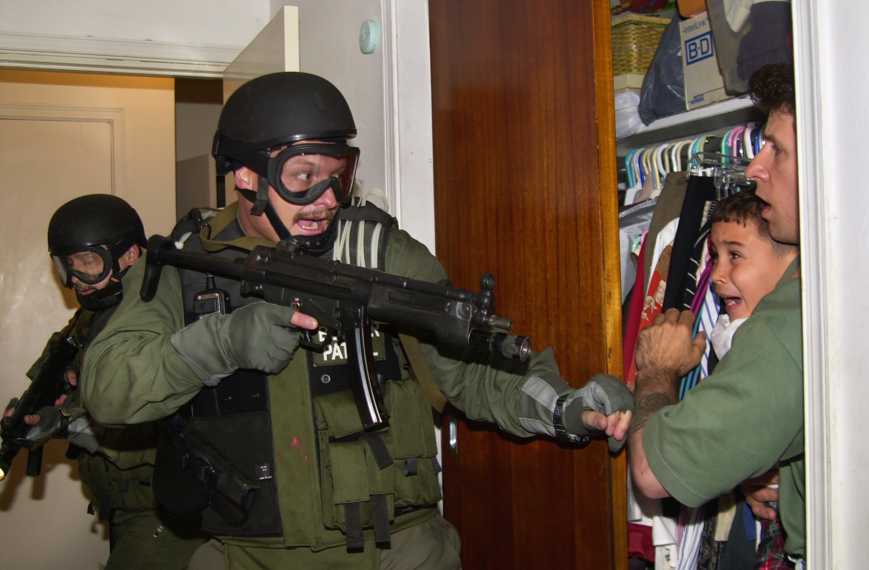 2001:  Alan Diaz – “The Taking of Elian.”  U.S. federal agents burst through the door of a Miami home on April 22, 2000, as they seize a Cuban boy named Elian Gonzalez.  Elian was hiding in a closet with Donato Dalrymple, one of two men who had rescued him from a raft off the Florida coast months earlier.  Elian’s U.S. based relatives lost a bitter legal battle with U.S. officials to prevent Elian from being returned to his father in Cuba.  The Gonzalez family allowed photographer Alan Diaz to wait for the raid with Dalrymple and the boy.