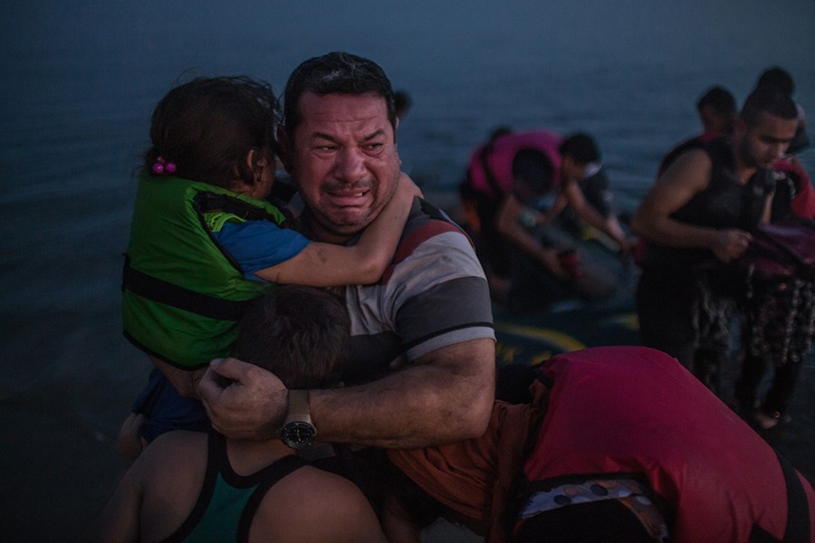 2016: (4):  Laith Majid, an Iraqi, broke out in tears, holding his son and daughter after they arrived safely in Kos, Greece, on a flimsy rubber boat.