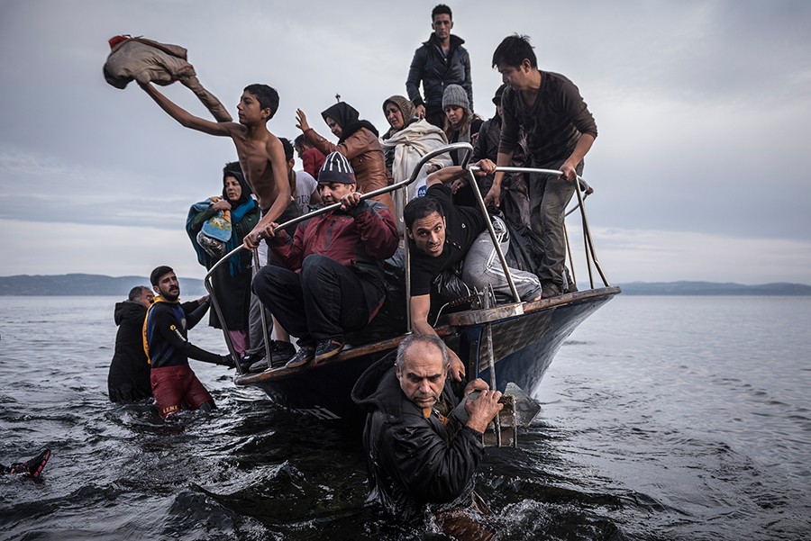 2016 Picture 3:  Migrants arrive by a Turkish boat near the village of Skala, on the Greek island of Lesbos. The Turkish boat owner delivered some 150 people to the Greek coast and tried to escape back to Turkey; he was arrested in Turkish waters.