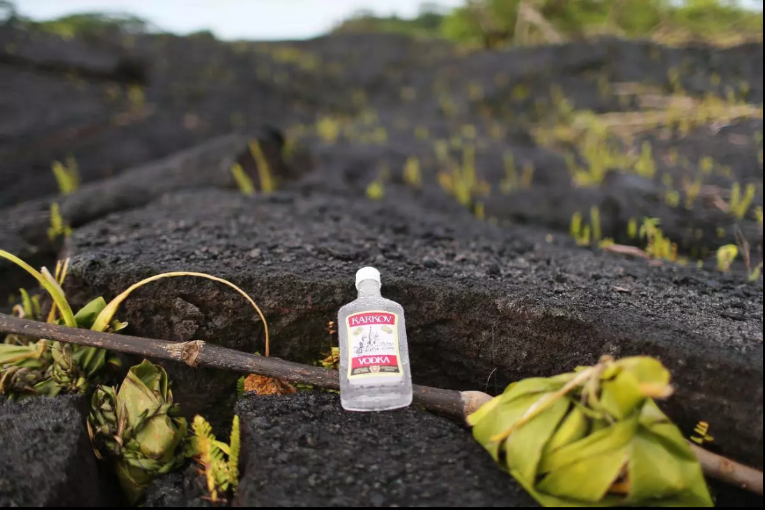Ti leaves and a bottle of alcohol are left as offerings to the Pele, the Hawaiian Goddess of Fire.