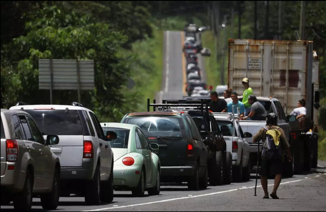 Residents jam a street after being allowed to briefly return home to check on belongings and pets in an evacuation zone on May 6 in Pahoa, HI.