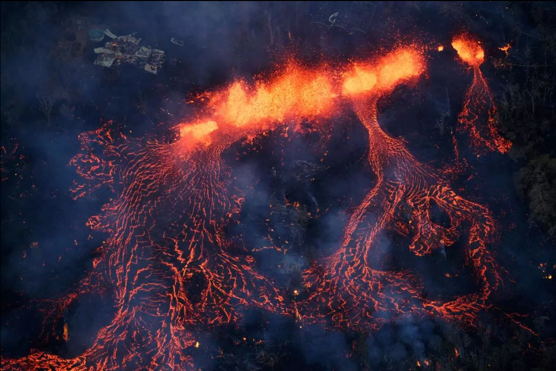 Aerial view of Kilauea’s east rift zone, as a fissure ejects lava more than 200 feet into the air.