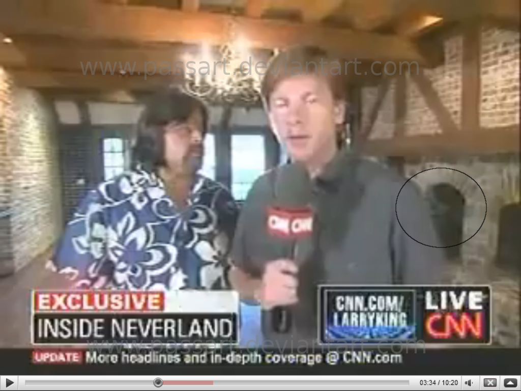 Look over the reporters left shoulder, looks alot like his face! No its not edited, the video can be seen on youtube, from the Larry King interview from Neverland. Picture caught at 3:35.