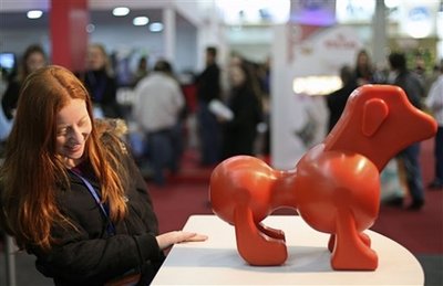 Visitors look at a prototype sex doll for dogs