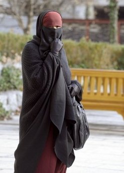 A Muslim woman wearing a niqab. An Arab ambassador called off his wedding after discovering his wife-to-be, who had worn a face-covering veil whenever they met, was bearded and cross-eyed,
